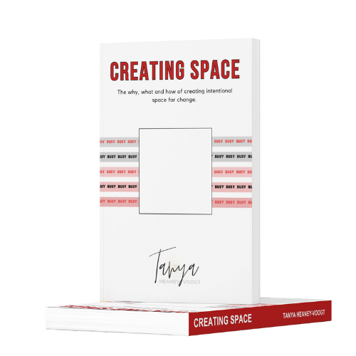 A book titled "Creating Space" by Tanya Heaney-Voogt, with a white cover and red accents, shown standing upright with a copy lying flat below it.