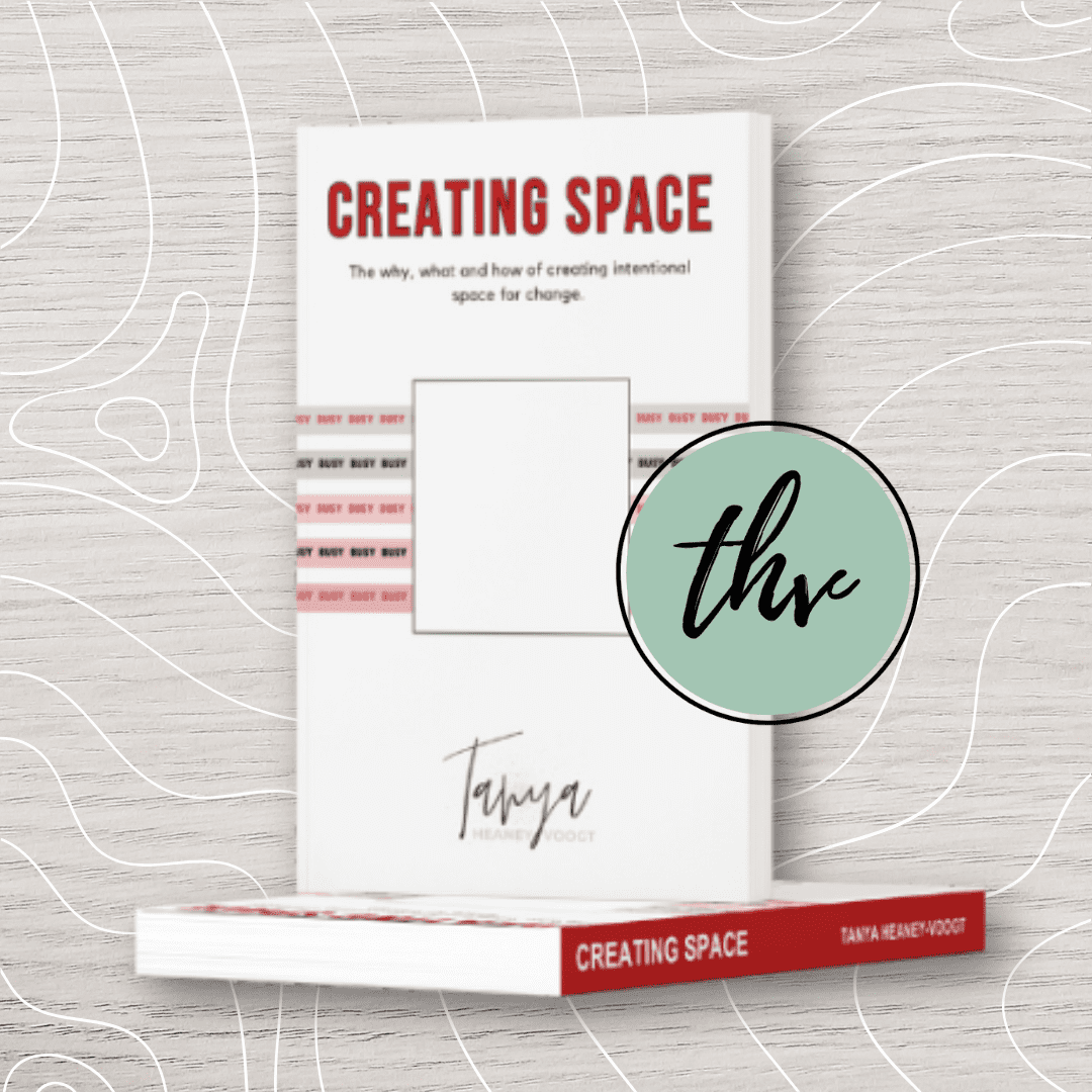 A book titled "Creating Space" by Tanya Heaney-Voogt, with a white cover and red accents, shown standing upright with a copy lying flat below it.