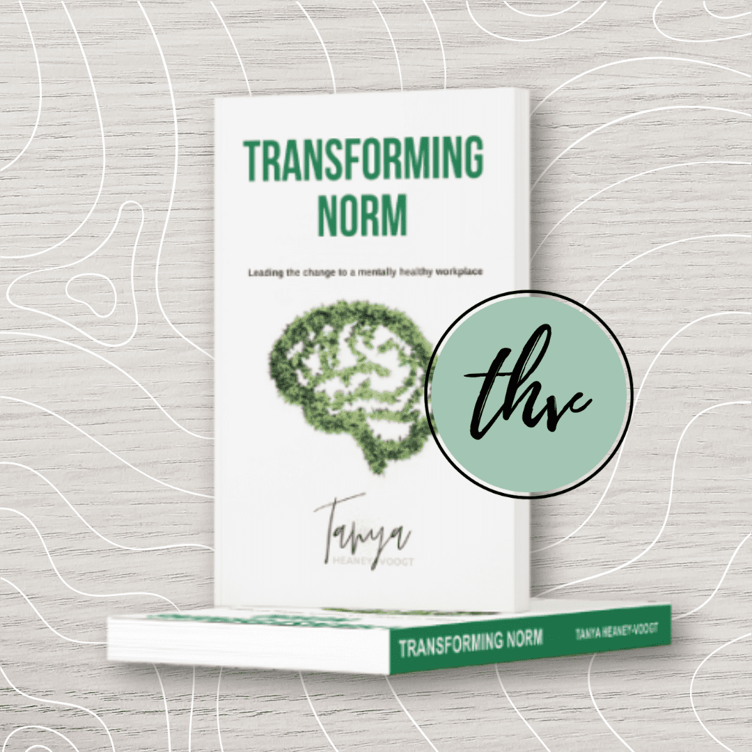 A book titled "Creating Space" by Tanya Heaney-Voogt, with a white cover and red accents, shown standing upright with a copy lying flat below it.